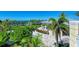 Landscaped patio with seating area and waterfront views at 330 Compass Point Dr # 101, Bradenton, FL 34209