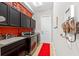 Laundry room with built-in cabinets and modern appliances at 330 Compass Point Dr # 101, Bradenton, FL 34209