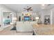 Living room with comfortable seating, a large TV, and access to outdoor space at 330 Compass Point Dr # 101, Bradenton, FL 34209