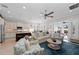 Open floorplan living room and kitchen with access to a balcony and water views at 330 Compass Point Dr # 101, Bradenton, FL 34209
