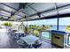 Community patio overlooking the pool and bay at 330 Compass Point Dr # 101, Bradenton, FL 34209