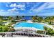 Resort-style pool with waterfront views and lounge chairs at 330 Compass Point Dr # 101, Bradenton, FL 34209