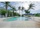Resort-style pool with lounge chairs and lush landscaping at 330 Compass Point Dr # 101, Bradenton, FL 34209