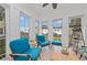 Sunroom with comfortable seating and large windows at 330 Compass Point Dr # 101, Bradenton, FL 34209