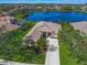 Aerial view of a single-Gathering home with a lake view in a quiet community at 4790 Sweetshade Dr, Sarasota, FL 34241