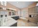 Large bathroom with double vanity, soaking tub, and tile flooring at 4790 Sweetshade Dr, Sarasota, FL 34241