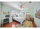 Bright bedroom with a full bed and built in desk at 4790 Sweetshade Dr, Sarasota, FL 34241