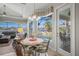Casual breakfast nook boasts water views and patio access at 4790 Sweetshade Dr, Sarasota, FL 34241