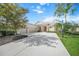 Beautiful two-story home with three-car garage and basketball hoop at 4790 Sweetshade Dr, Sarasota, FL 34241
