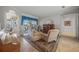 Bright living room with access to the pool and lake views at 4790 Sweetshade Dr, Sarasota, FL 34241