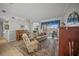 Spacious living room with a piano and access to a patio at 4790 Sweetshade Dr, Sarasota, FL 34241