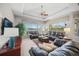 Spacious living room featuring leather furniture and water views at 4790 Sweetshade Dr, Sarasota, FL 34241