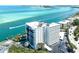Stunning aerial view of condo building with gorgeous waterfront views of blue ocean at 4822 Ocean Blvd # 8C, Sarasota, FL 34242
