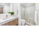 Modern bathroom features glass shower, white stone tiles, and stone flooring at 4822 Ocean Blvd # 8C, Sarasota, FL 34242