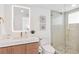 Modern bathroom with glass walk-in shower, sleek vanity, pebble floor, and contemporary fixtures at 4822 Ocean Blvd # 8C, Sarasota, FL 34242