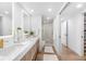 Bright bathroom with double vanity, walk-in shower, and modern fixtures at 4822 Ocean Blvd # 8C, Sarasota, FL 34242
