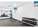 Well-equipped gym featuring free weights, exercise balls, a mirror, and mounted television at 4822 Ocean Blvd # 8C, Sarasota, FL 34242