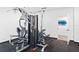 Weight room with resistance machines, rubber flooring, and bright lighting at 4822 Ocean Blvd # 8C, Sarasota, FL 34242