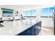 Well-appointed kitchen with an island cooktop, stainless steel appliances, and bright lighting at 4822 Ocean Blvd # 8C, Sarasota, FL 34242