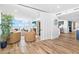 Spacious living area with sliding glass doors, hardwood floors, and modern furnishings at 4822 Ocean Blvd # 8C, Sarasota, FL 34242
