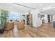 Spacious living area with sliding glass doors, hardwood floors, and modern furnishings at 4822 Ocean Blvd # 8C, Sarasota, FL 34242