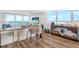 Open-concept living room with floor-to-ceiling windows offers stunning ocean views and abundant natural light at 4822 Ocean Blvd # 8C, Sarasota, FL 34242