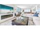 Open floor plan with fireplace, modern furniture and an ocean view at 4822 Ocean Blvd # 8C, Sarasota, FL 34242