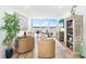 Cozy living room featuring contemporary decor, hardwood floors, and sun-filled windows with a great view at 4822 Ocean Blvd # 8C, Sarasota, FL 34242