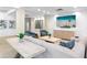 Comfortable lobby with a large screen television, several seating options, and modern decor at 4822 Ocean Blvd # 8C, Sarasota, FL 34242