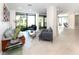Spacious lobby area with tiled floors, seating, plants, and a contemporary design at 4822 Ocean Blvd # 8C, Sarasota, FL 34242