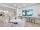Relaxing lounge area with comfortable seating, a counter with bar stools and stunning water views at 4822 Ocean Blvd # 8C, Sarasota, FL 34242