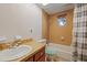 Clean bathroom with tub and shower at 4904 9Th Street E Ct, Bradenton, FL 34203