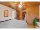 Bedroom with wood-paneled walls and built-in storage at 4904 9Th Street E Ct, Bradenton, FL 34203