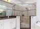 Elegant bathroom with a large walk-in shower and granite countertops at 5062 Flagstone Dr, Sarasota, FL 34238