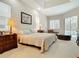 Spacious main bedroom with ample natural light and access to backyard views at 5062 Flagstone Dr, Sarasota, FL 34238