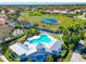 Aerial view of community pool with surrounding landscape at 5062 Flagstone Dr, Sarasota, FL 34238