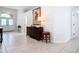 Bright and airy foyer with tiled flooring and a stylish console table at 5062 Flagstone Dr, Sarasota, FL 34238