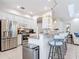 Modern kitchen with stainless steel appliances and breakfast bar at 5062 Flagstone Dr, Sarasota, FL 34238