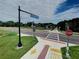 View of a road with a crosswalk and park entrance at 5062 Flagstone Dr, Sarasota, FL 34238