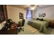 Second bedroom with a queen bed and home office space at 514 Spring Lakes Blvd, Bradenton, FL 34210