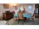 Dining area with table and chairs, adjacent to living room at 514 Spring Lakes Blvd, Bradenton, FL 34210