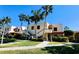 Tan two-story building with stairs, palm trees, and walkways at 514 Spring Lakes Blvd, Bradenton, FL 34210