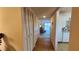 Hallway with built-in storage and view into living area at 514 Spring Lakes Blvd, Bradenton, FL 34210