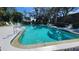 Community pool with lounge chairs at 514 Spring Lakes Blvd, Bradenton, FL 34210