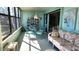 Relaxing sunroom with lake view and seating at 514 Spring Lakes Blvd, Bradenton, FL 34210