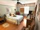 Cozy bedroom with a double bed, ceiling fan and wood flooring at 515 30Th W Ave # H207, Bradenton, FL 34205