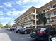 Condo building with parking and landscaping at 515 30Th W Ave # H207, Bradenton, FL 34205