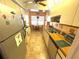 Fully equipped kitchen offering ample cabinet space and a view of the living area at 515 30Th W Ave # H207, Bradenton, FL 34205