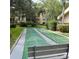 Community shuffleboard court with benches at 515 30Th W Ave # H207, Bradenton, FL 34205
