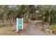 Park entrance with paved trail and informational sign at 5205 26Th W Ave, Bradenton, FL 34209